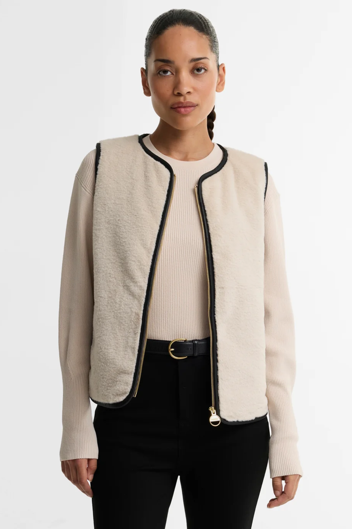 Barbour International Oulton Faux Fur Liner Lt Stone/Black LLI0028 on model Shop Barbour International at Dotique