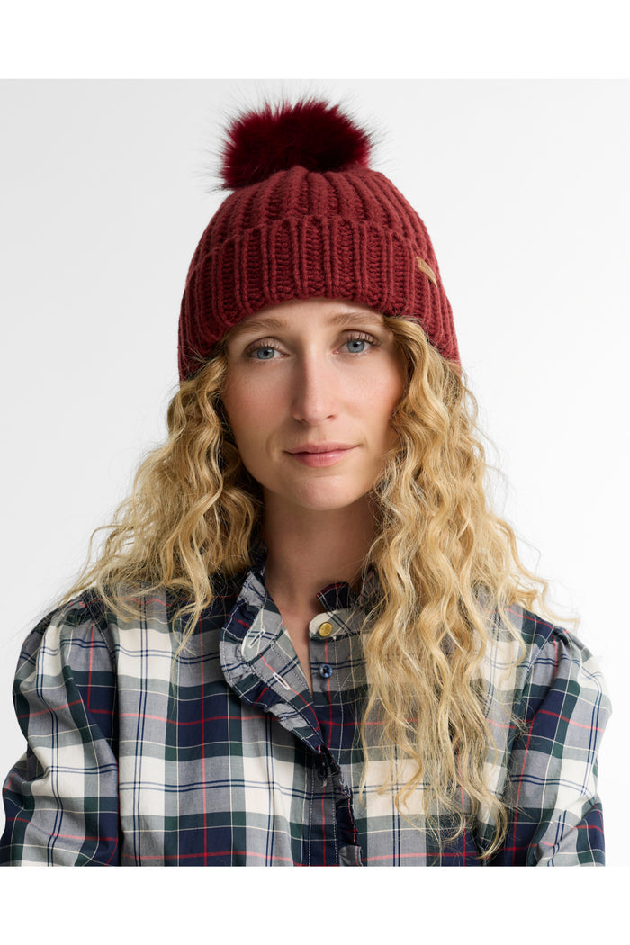 Barbour Saltburn Beanie & Scarf Gift Set Cranberry LGS0023 red pom pom beanie worn by model Shop Barbour at Dotique