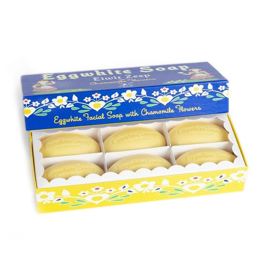 Set of six eggwhite soaps in decorative box with floral designs on white background