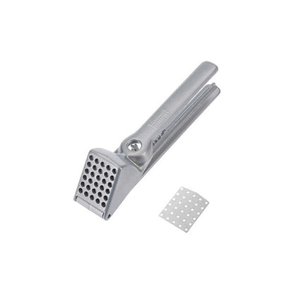 Metal garlic press on a white background