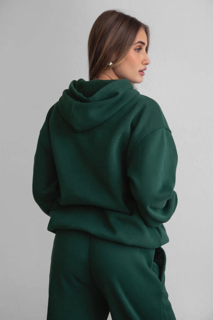 Side view of hoodie showing relaxed fit and dropped shoulder seams.