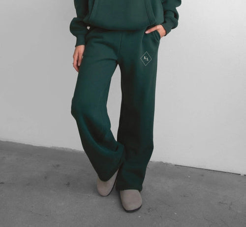 Flat lay of the full fleece set including hoodie and pants in navy blue.
