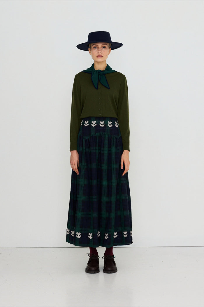 Tiny Big Sister Embroidered Check Skirt AW26-755 on model Shop Tiny Big Sister at Dotique