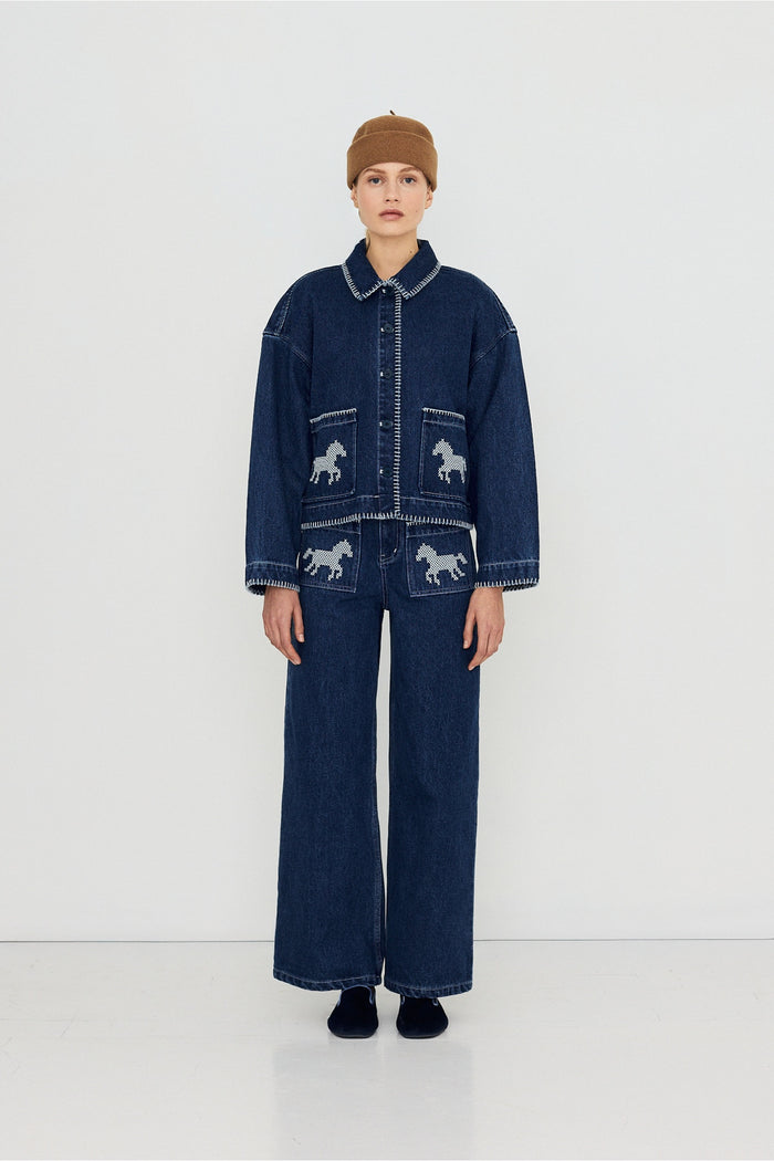 Tiny Big Sister Embroidered Horses Denim Jacket AW26-788 worn by model Shop Tiny Big Sister at Dotique