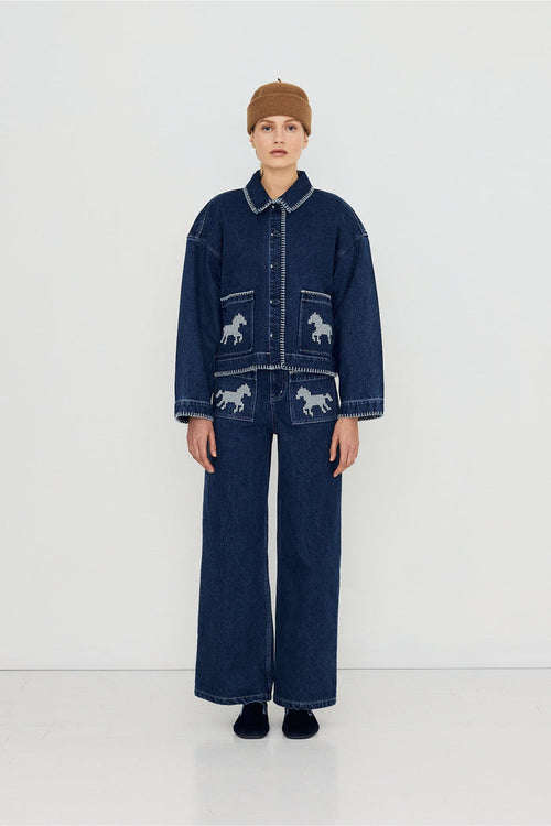Tiny Big Sister Embroidered Horses Denim Jacket AW26-788 worn by model Shop Tiny Big Sister at Dotique