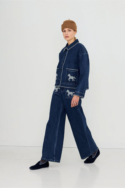 Tiny Big Sister Embroidered Horses Denim Jacket AW26-788 on model Shop Tiny Big Sister at Dotique