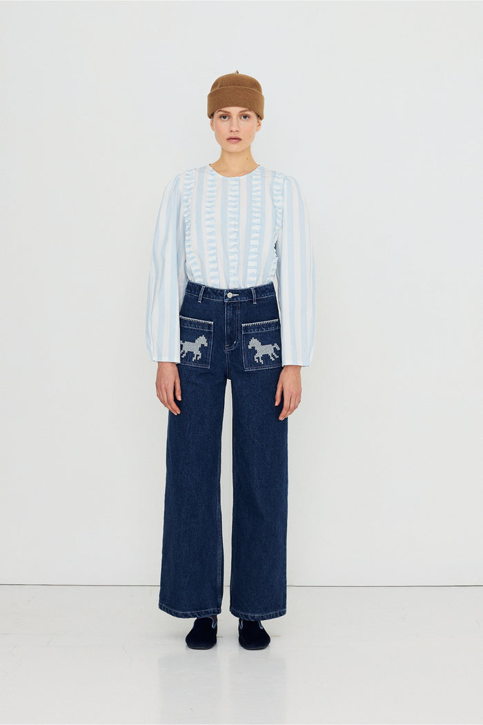 Tiny Big Sister Embroidered Horses Denim Trousers AW26-789 worn by model Shop Tiny Big Sister at Dotique